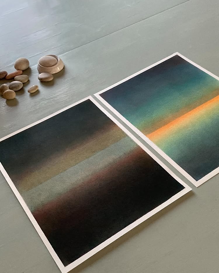 Lifestyle photo showing art prints displayed with decorative stones, interior design inspiration for Scandinavian home decor